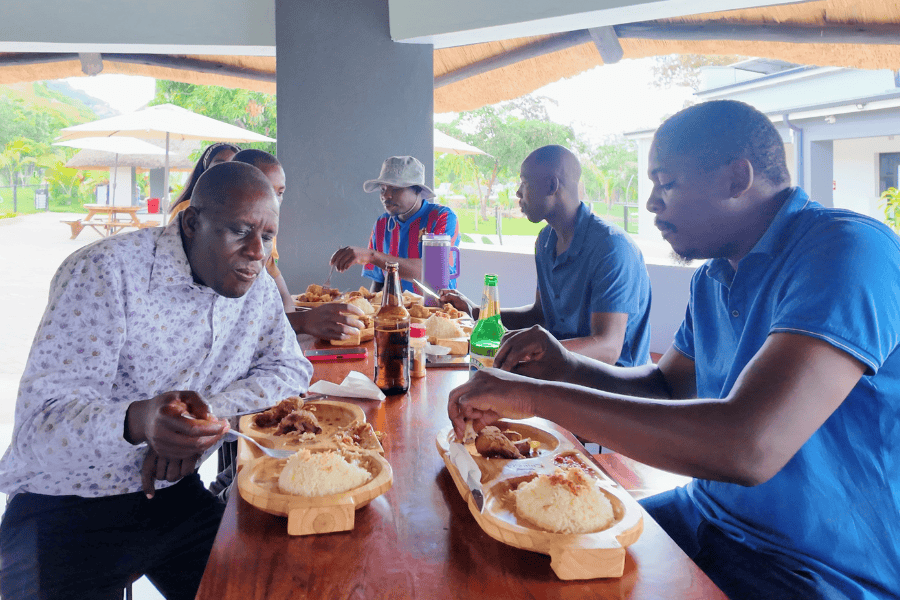 Men enjoying Traditional Zimbabwean Cuisine